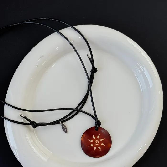 Solar Graphic Pendant Leather N.