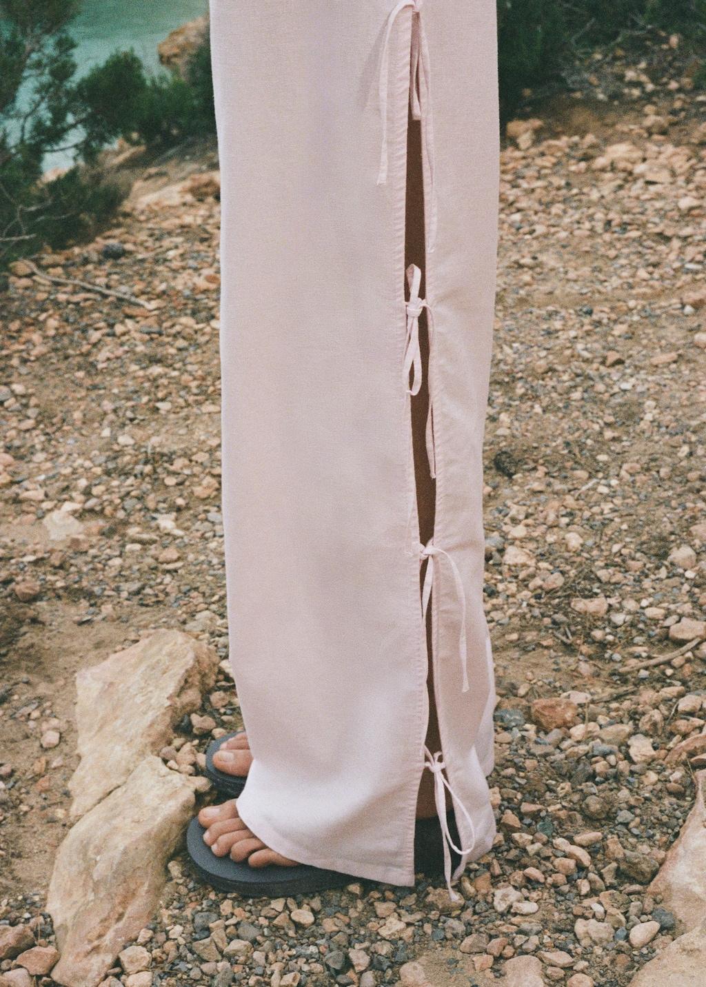 Straight trousers with slits and bows