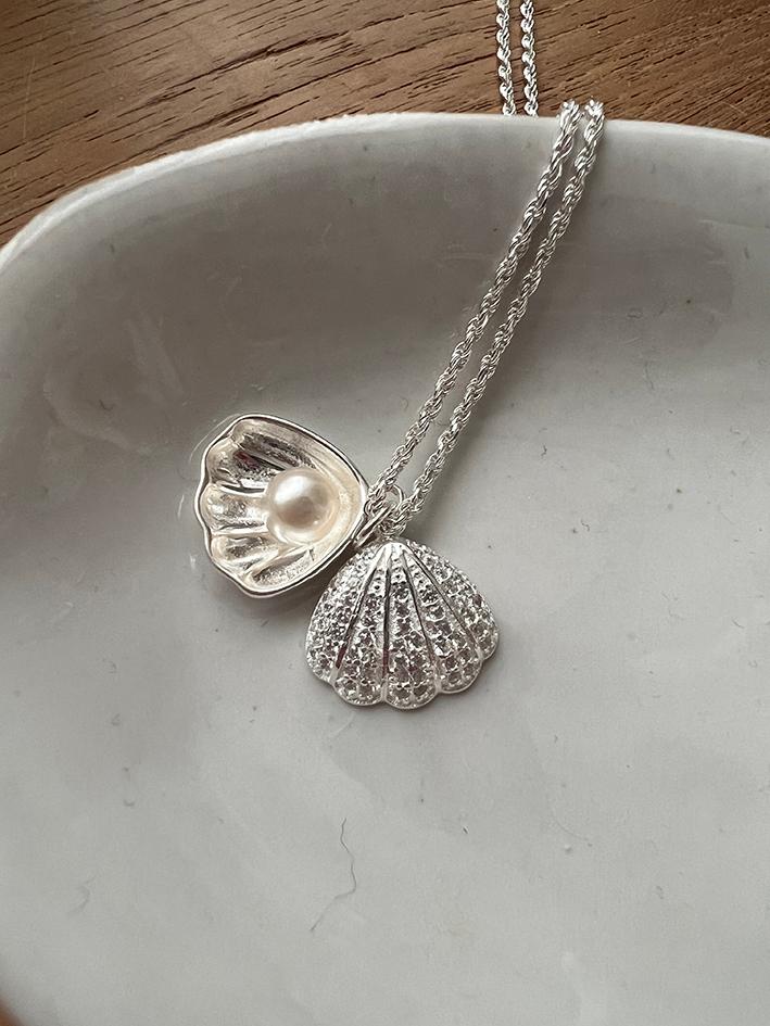 Pearl in shell necklace