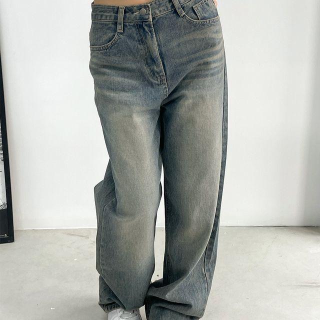 holding washing denim pants