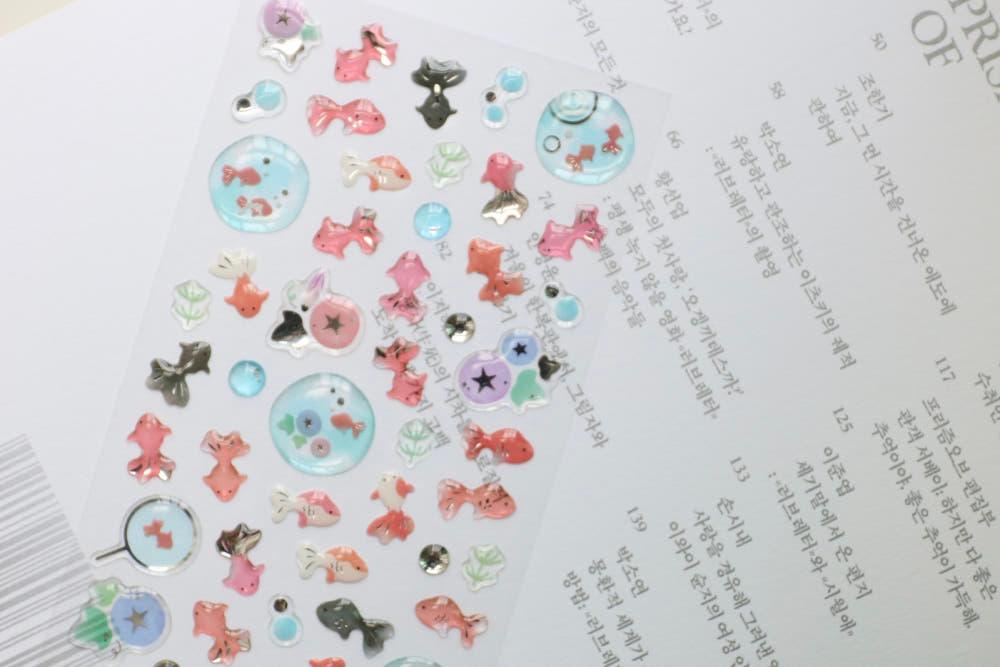 느린 물결, 금붕어 스티커