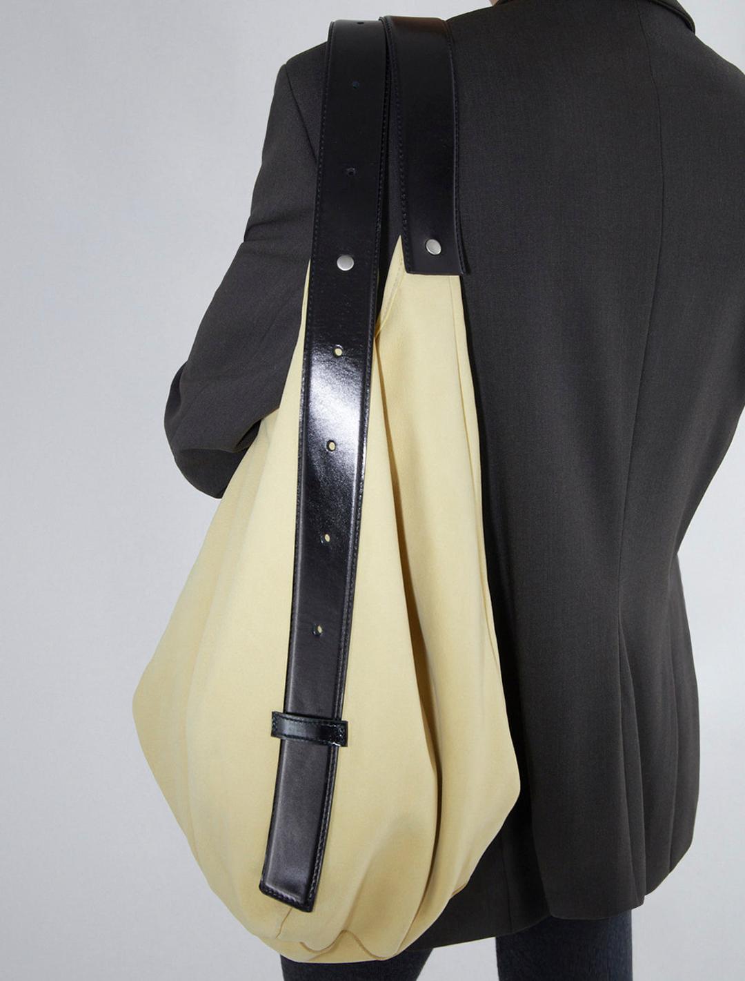 BIG EMILIE BAG-Yellow big bucket bag featuring a belt-inspired handle design