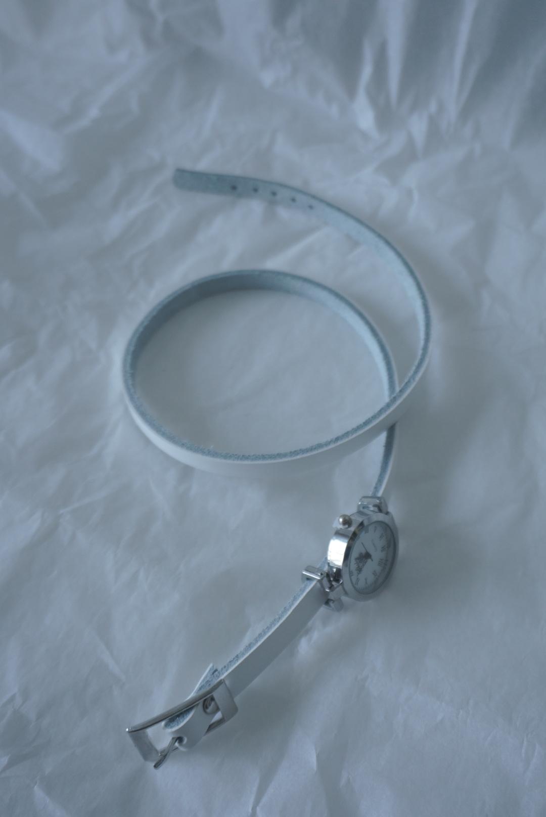 white three-line watch