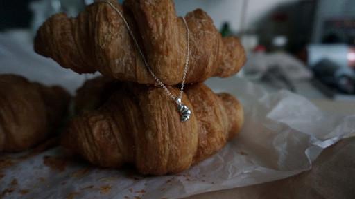 rised croissant necklace