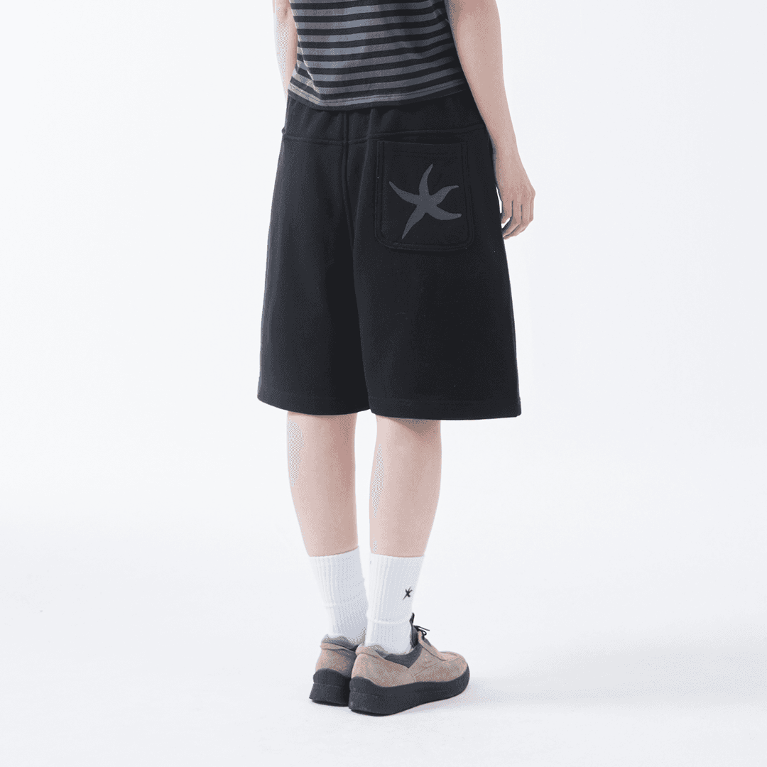 TCM back logo half sweat pants (black)