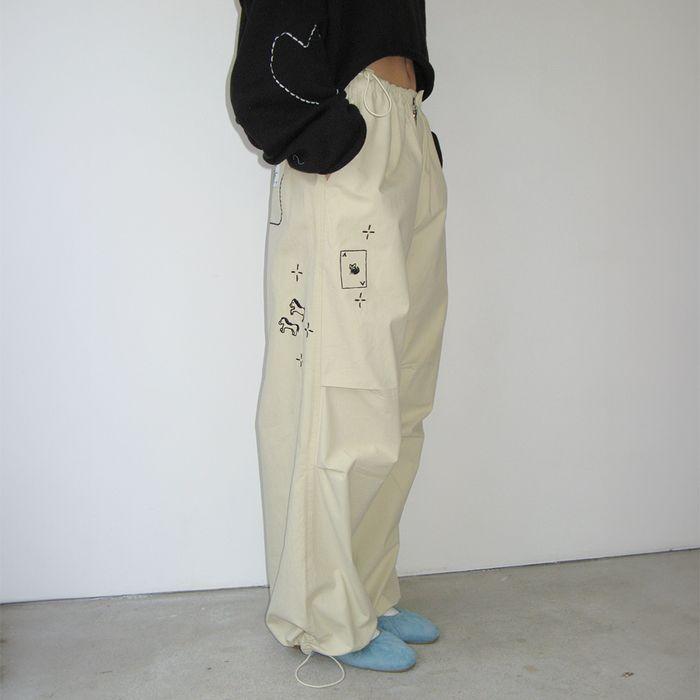 DRAWING STITCH PARACHUTE PANTS BEIGE