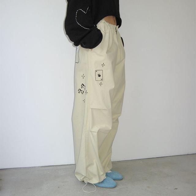 DRAWING STITCH PARACHUTE PANTS BEIGE