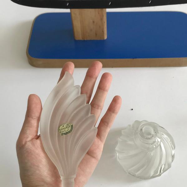 warehouse/ swirling glass bottle