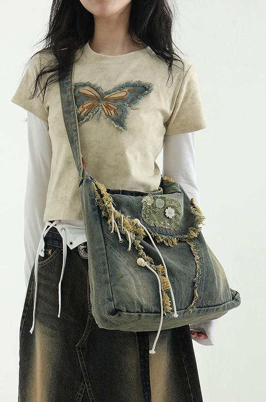 flower patched eylet tassel denim bag
